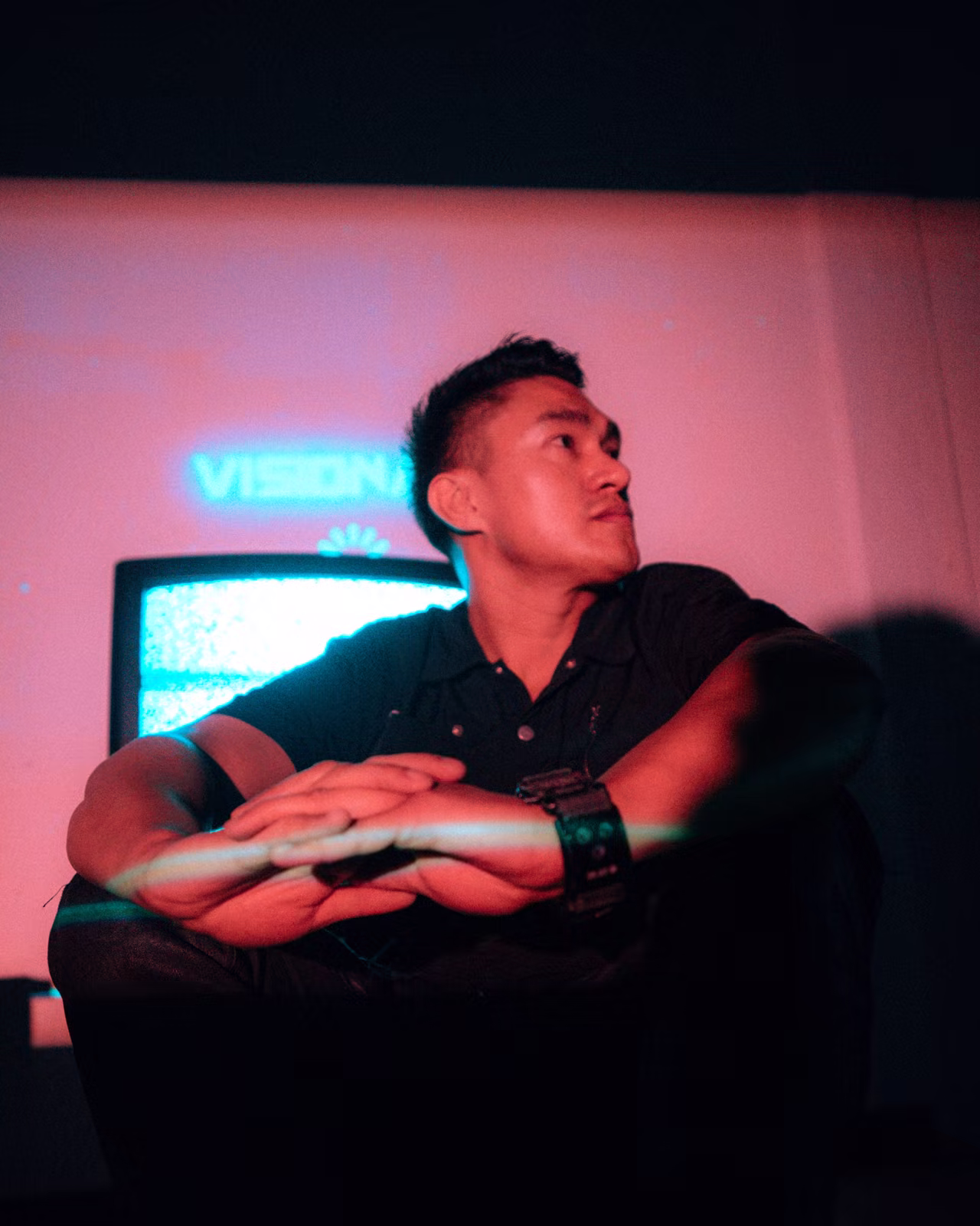 Christopher Davila identity portrait under neon light, kept as an identity-frame proof point.